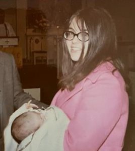 Marsha Valance '68 holding baby