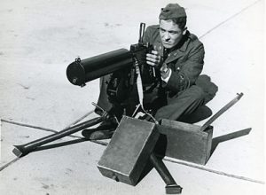 A cadet learns to operate a machine gun.