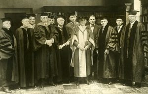 Delegates attending the dedication of UCLA's new campus: UC President William Wallace Campbell (center, holding book), Vice President and Comptroller Robert Gordon Sproul (on Campbell's right) and Regent Edward A. Dickson (second from far right).