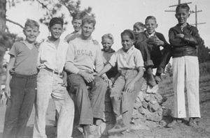 UniCamp student counselor poses with his all-male camp group in 1935