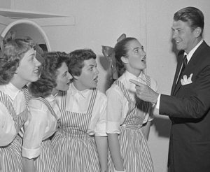 Members of the Delta Zeta quartet test out their vocals for Master of Ceremonies Ronald Reagan in a warm-up to the May 3, 1957, Spring Sing