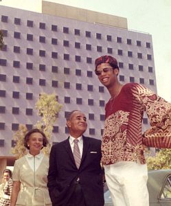 Ralph Bunche ’27 and his wife, Ruth, with Lew Alcindor ’69 (Kareem Abdul-Jabbar) outside the Bunche Hall dedication ceremonies