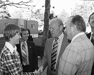 Judith Holland, director of the Department of Women's Intercollegiate Sports, greets former President Gerald Ford during his visit to UCLA in 1978.