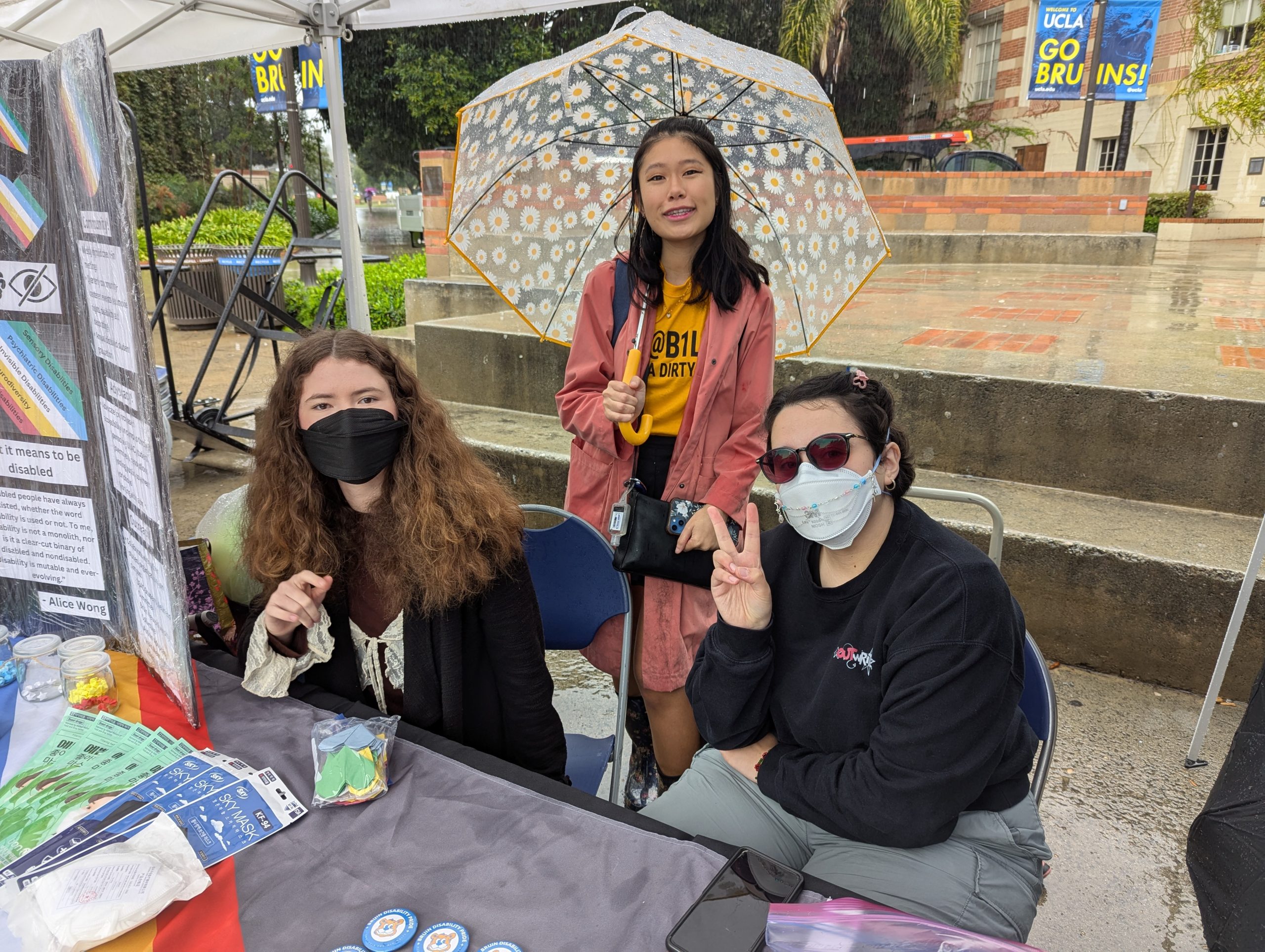 Three UDAN members at table with swag