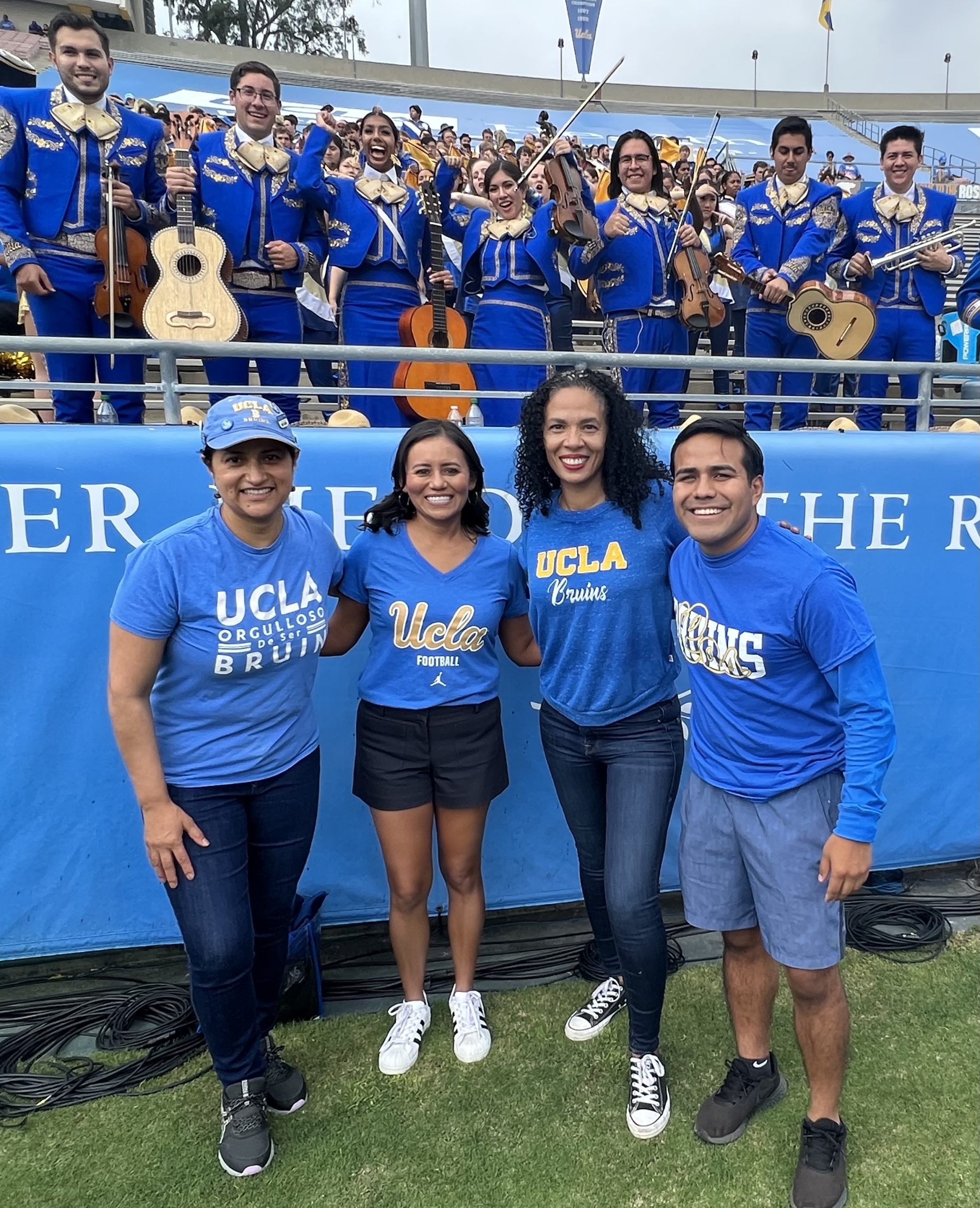 Four Latino alums at game