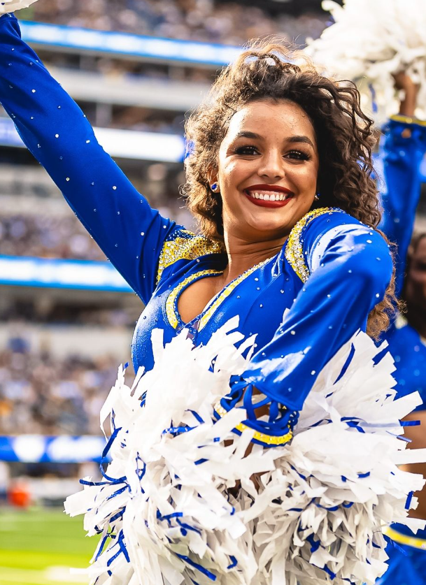 Mia Robertson '22 with L.A. Rams Cheerleaders