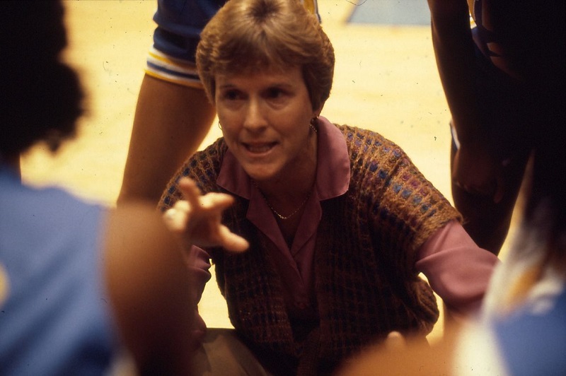 Billie Moore in huddle