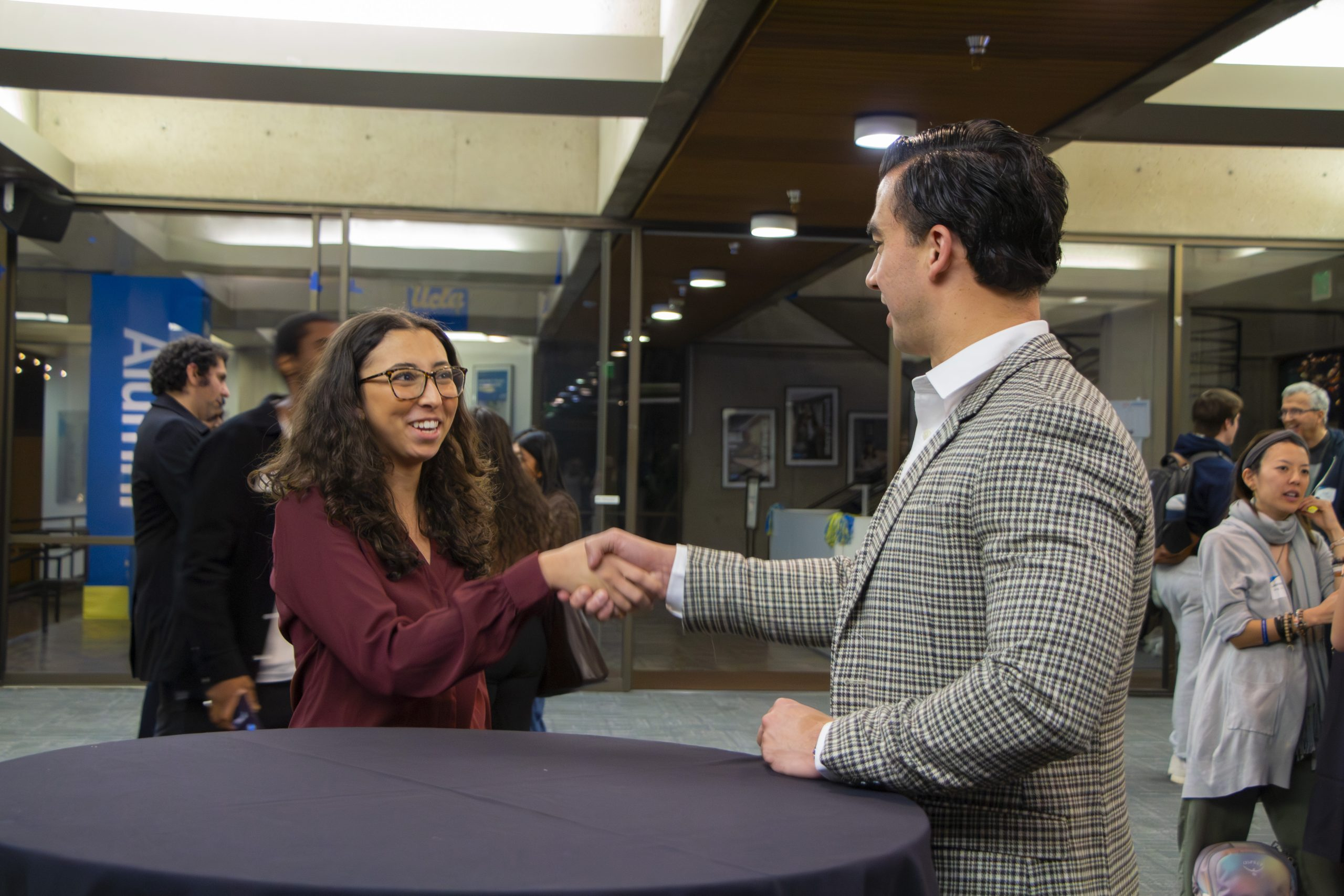 Student and mentor shaking hands
