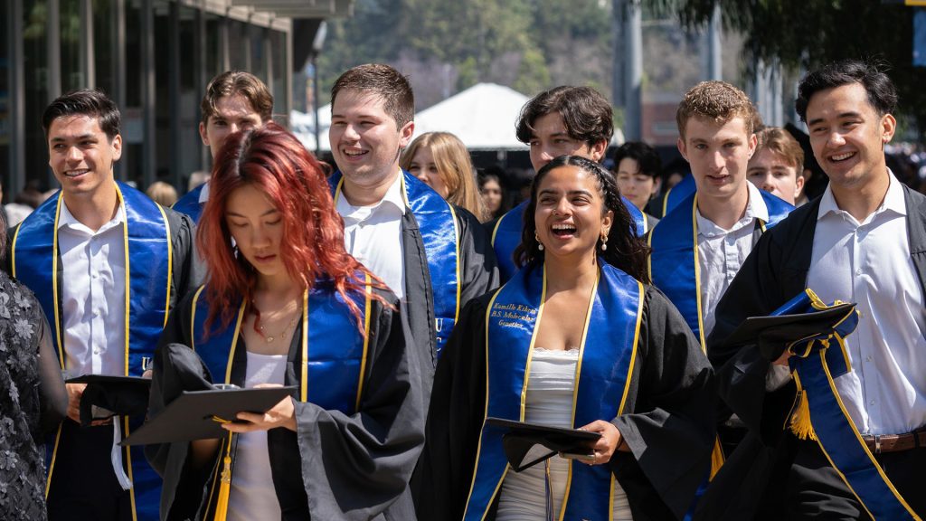 Graduating students in gowns.