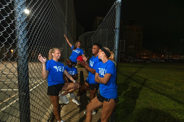 Group of players in a field with Volo shirts.